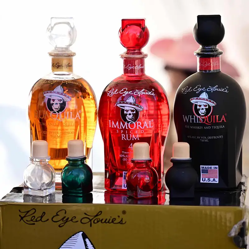 Brand Engagement: Visitors at FoodEx Japan 2026 holding Red Eye Louie’s branded merchandise and keychains.